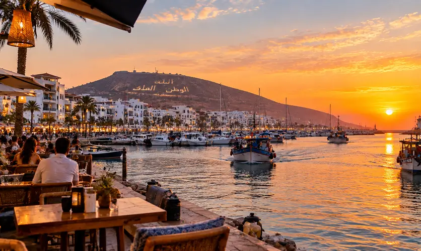 Agadir Marina at sunset, boats coming in along the waterfront