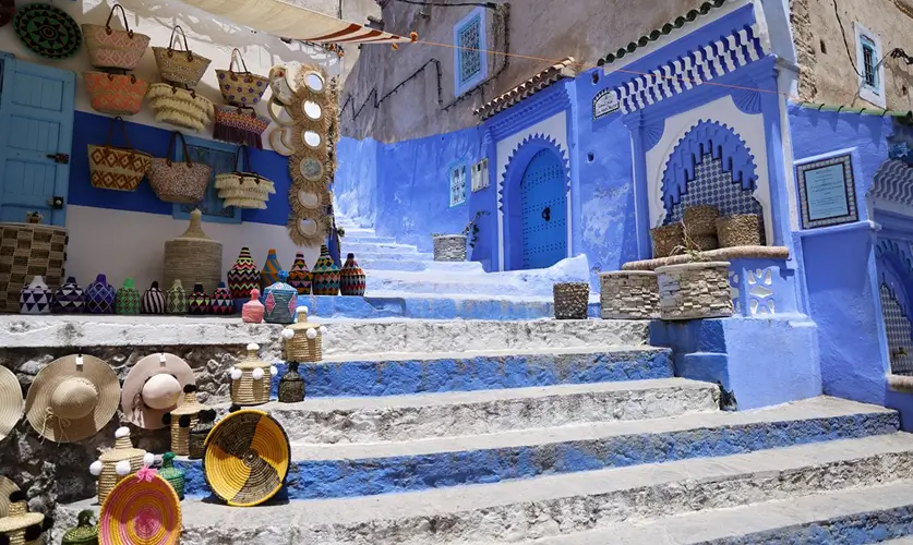 Blue-painted stairs and walls in a narrow alley of the Chefchaouen medina