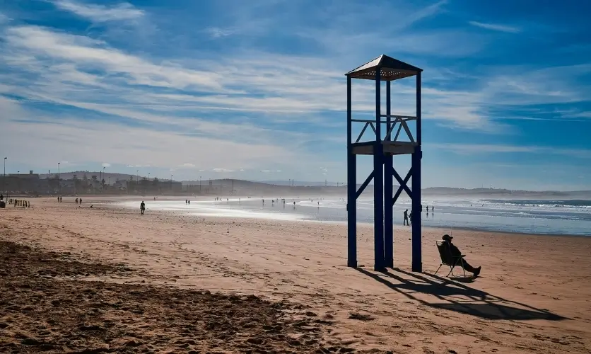 Atlantic waves breaking on the wide sandy Essaouira beach on a windy day