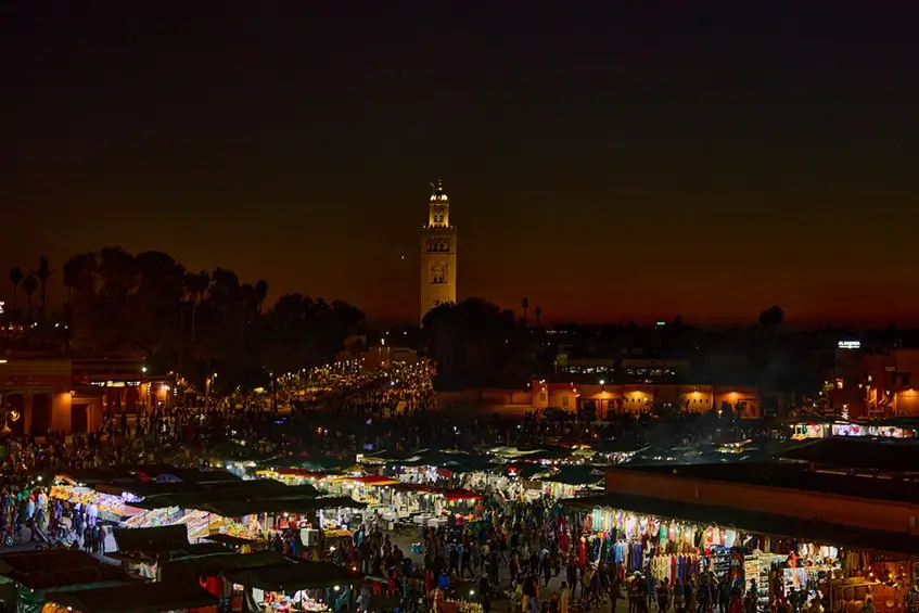 Is Marrakech safe at night Jemaa el-Fna square lit up at twilight.